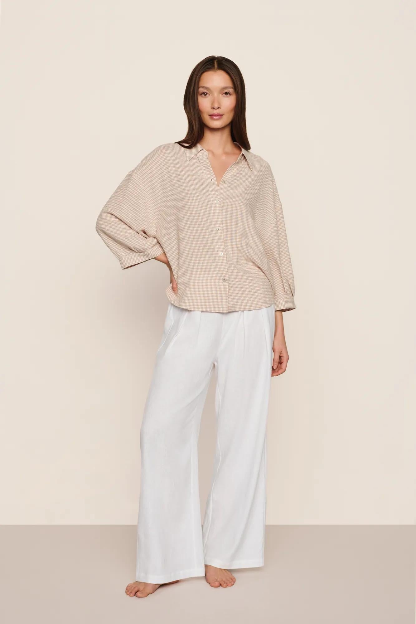 Model is wearing Linen Blend Relaxed Quarter Sleeve Top in Gingham White/Warm Taupe