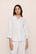 Model is wearing Linen Blend Relaxed Quarter Sleeve Top in White
