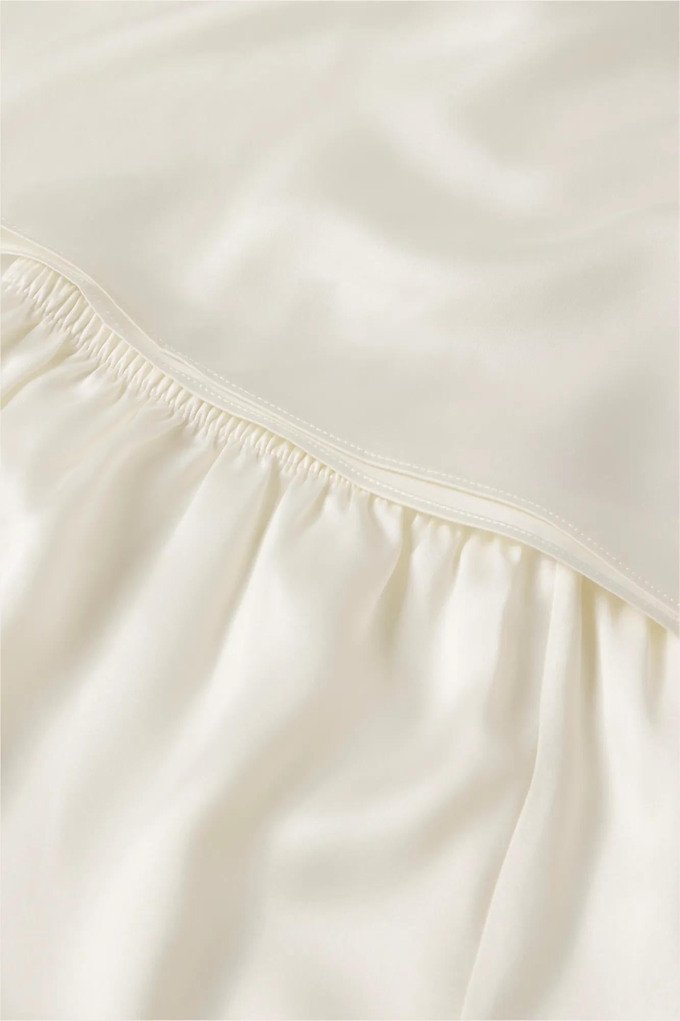 Model is wearing Washable Silk with Lace Embroidery Long Sleeve Top & Short PJ Set in Ivory