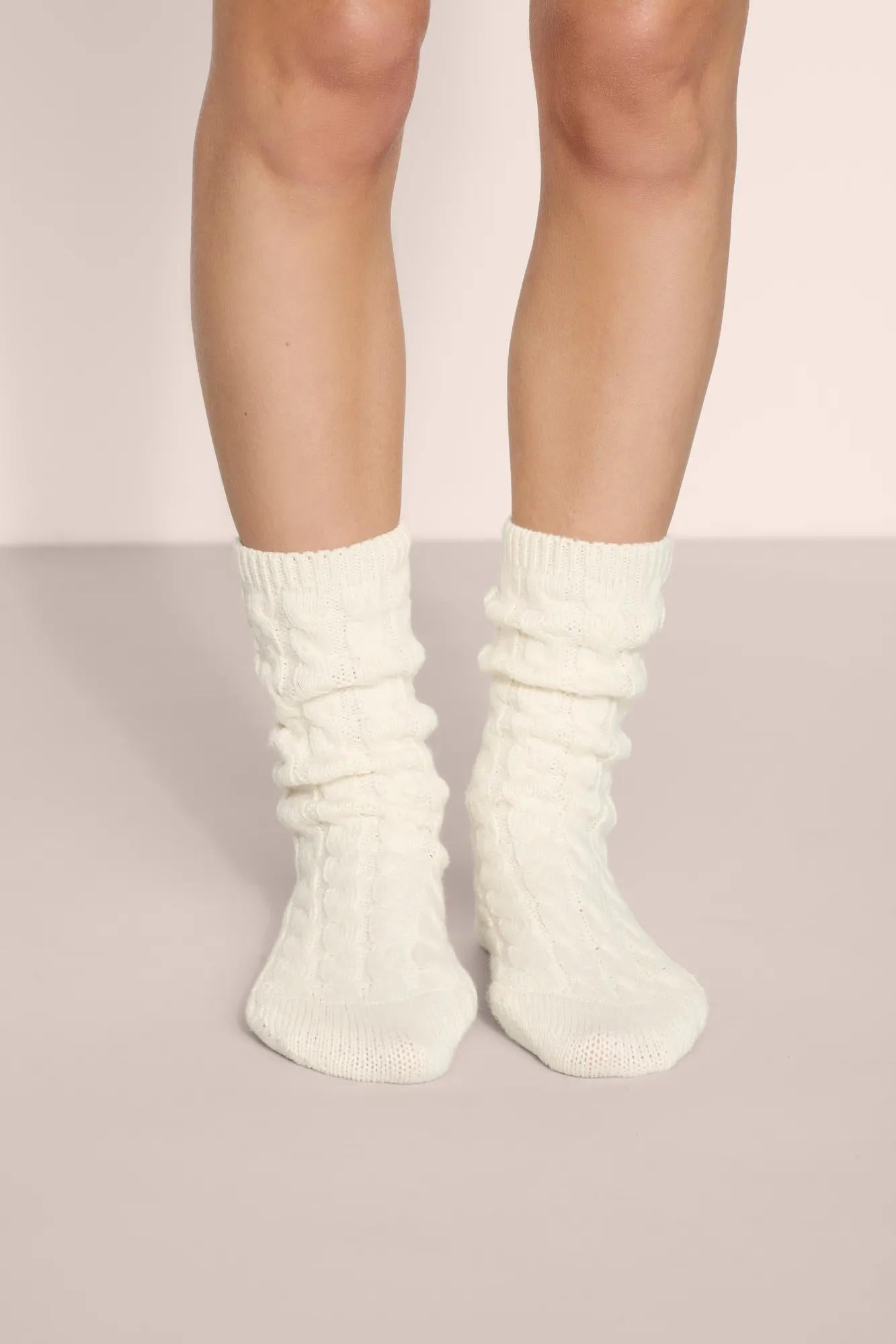 Model is wearing Cozy Socks in Ivory