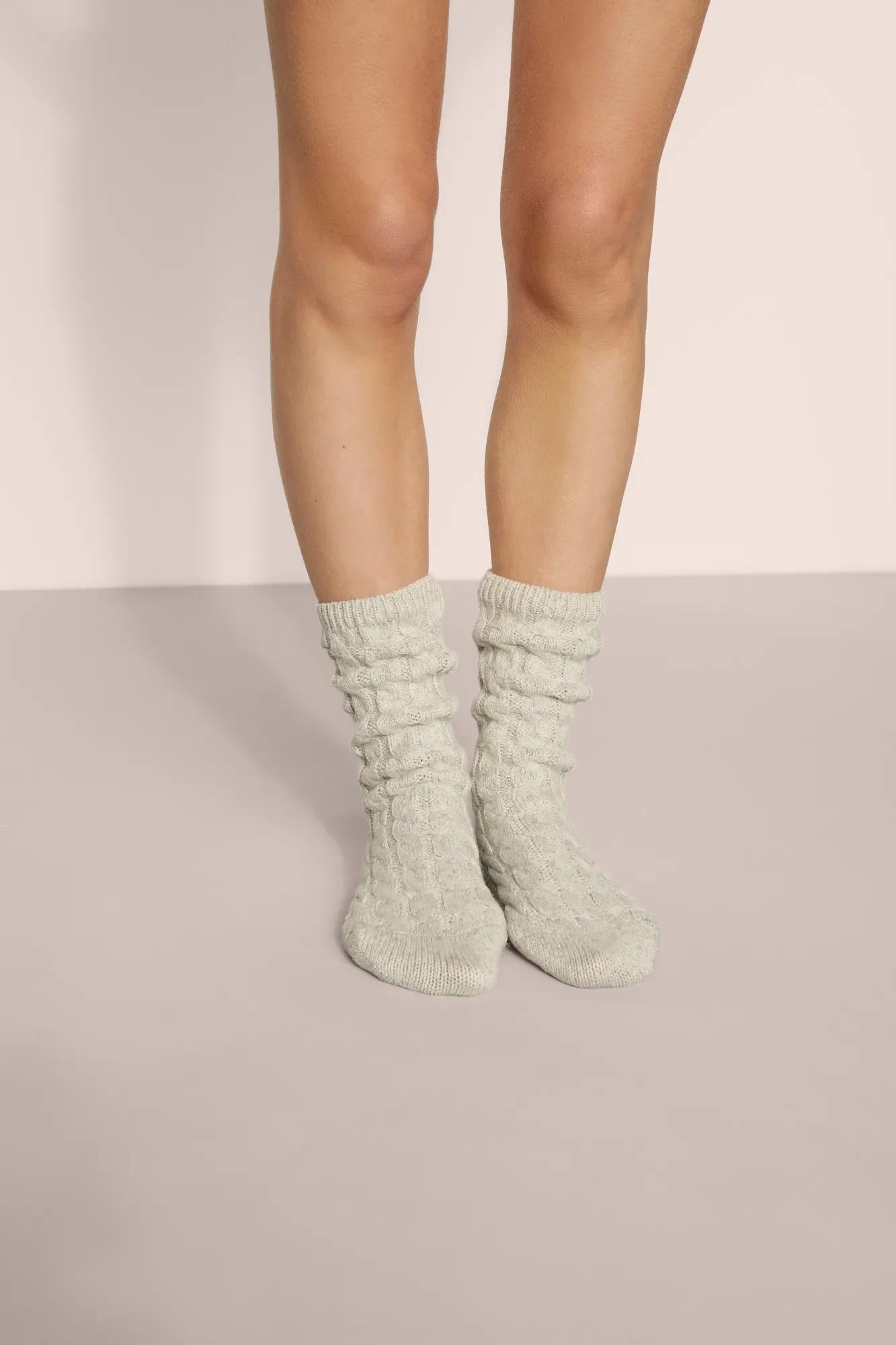 Model is wearing Cozy Socks in Lt. Heather Grey