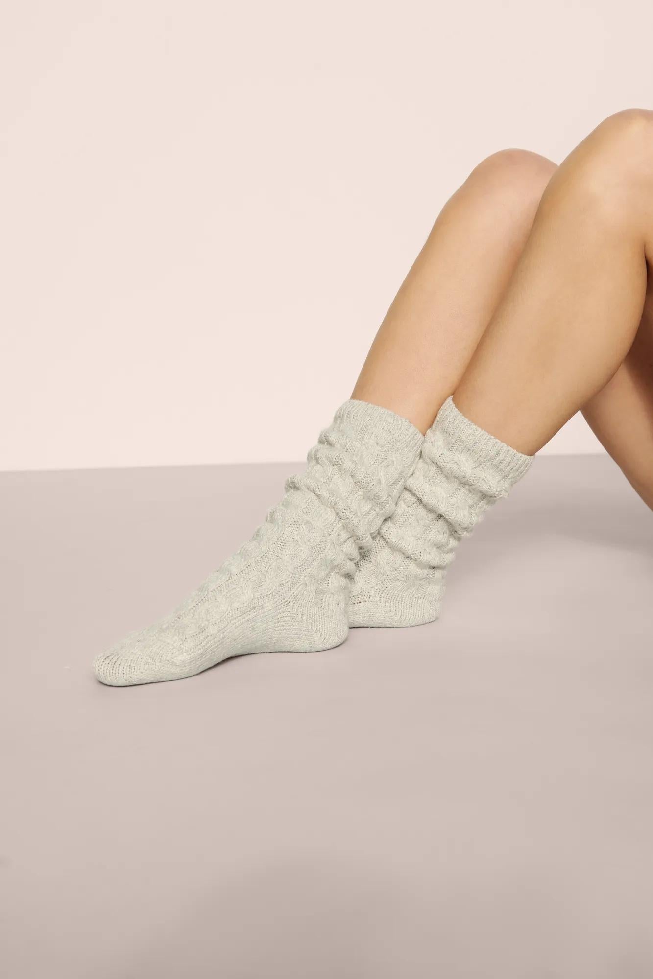 Model is wearing Cozy Socks in Lt. Heather Grey
