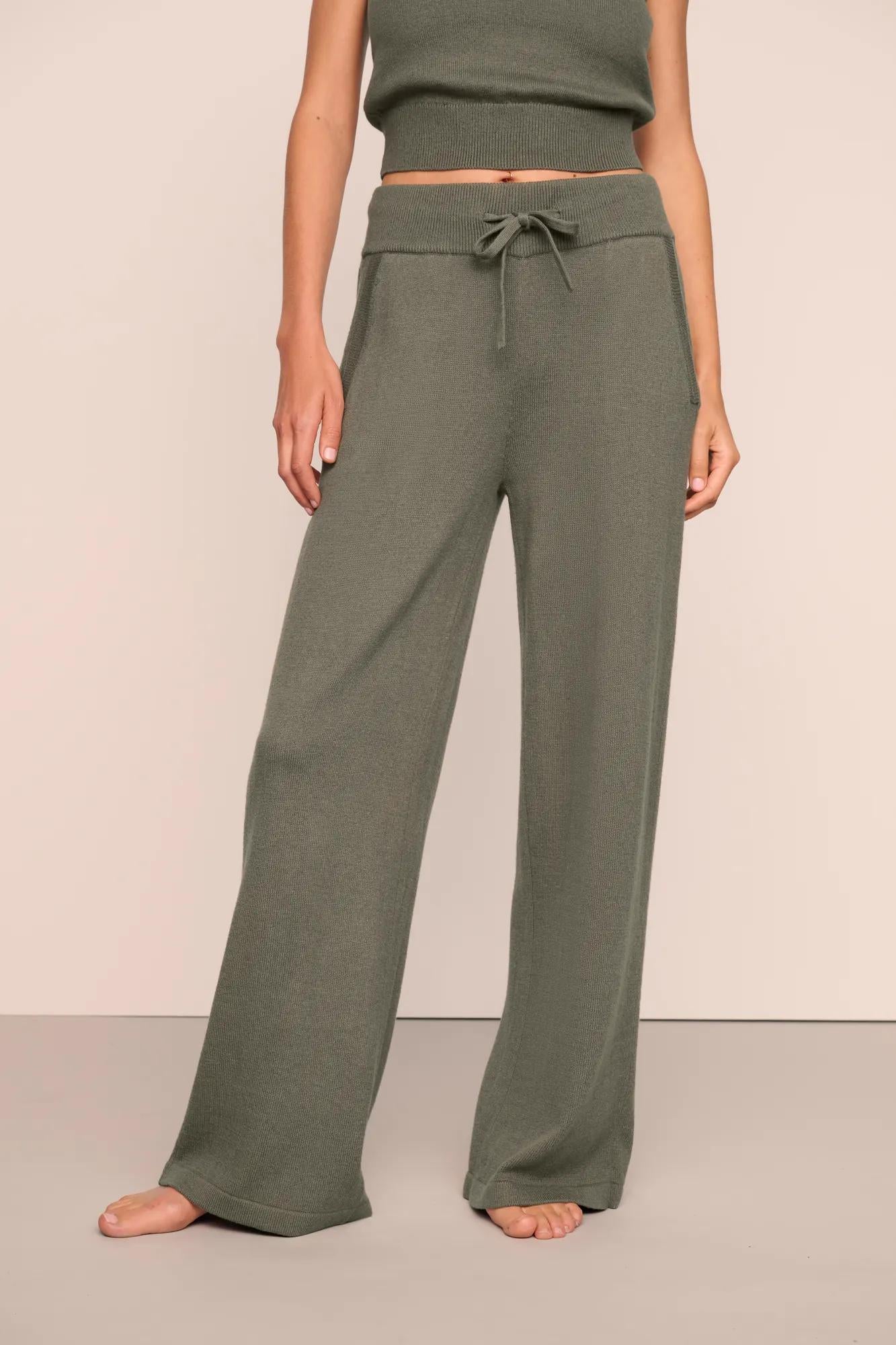 Model is wearing Recycled Sweater Pant  in Smokey Olive
