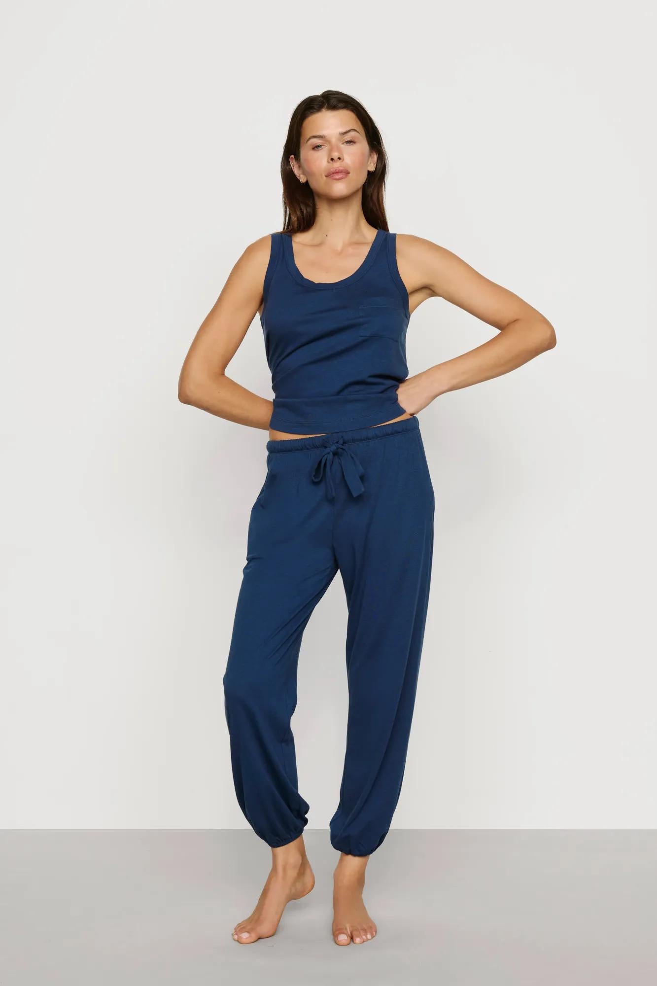 Model is wearing Aloe Cotton Pant in Navy