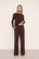 Model is wearing Gisele TENCEL™ Modal Everyday Straight Leg Pant in Chocolate