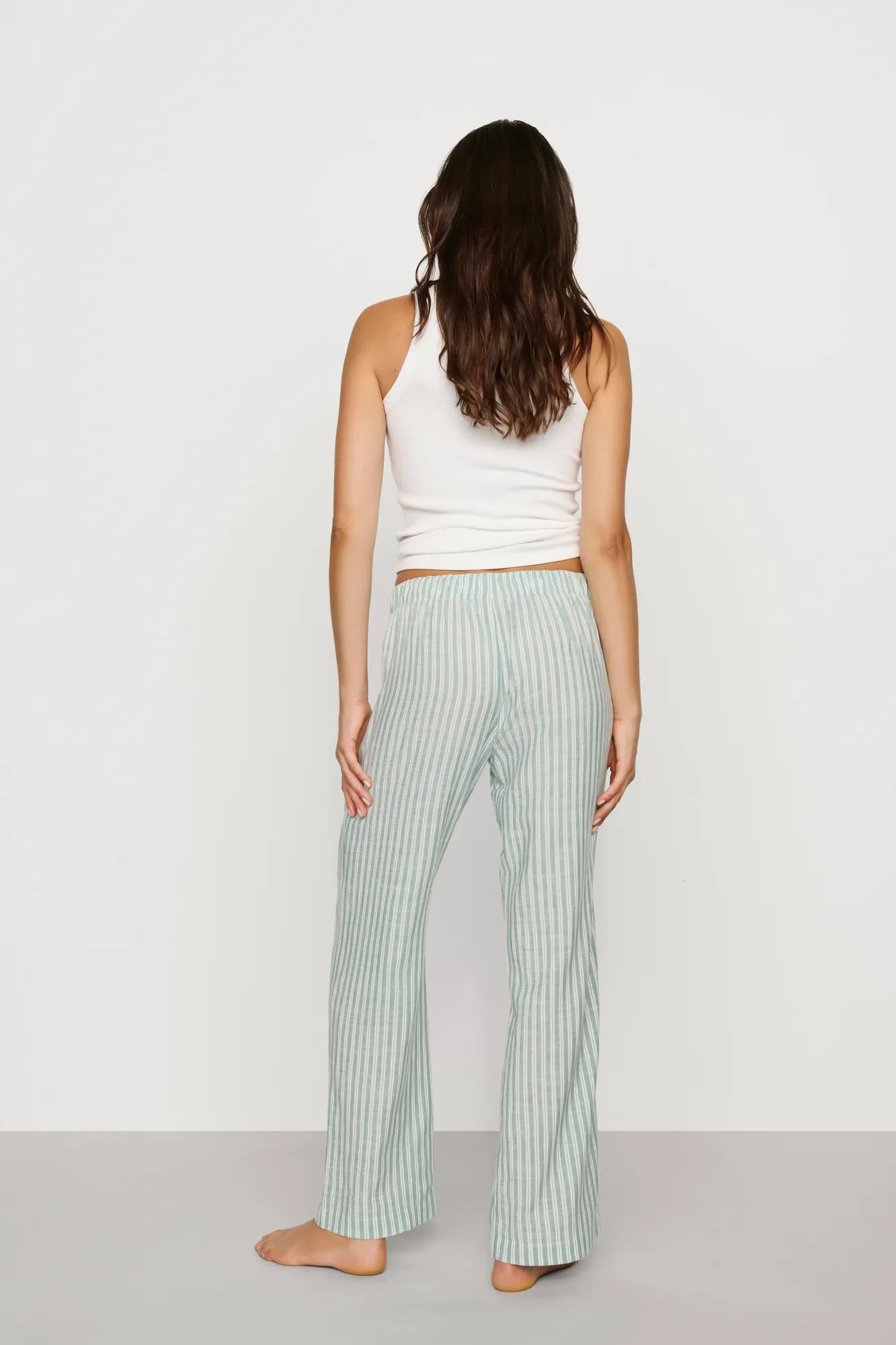 Model is wearing Nautico Boxer Pant in Regatta Stripe Seagrass/White