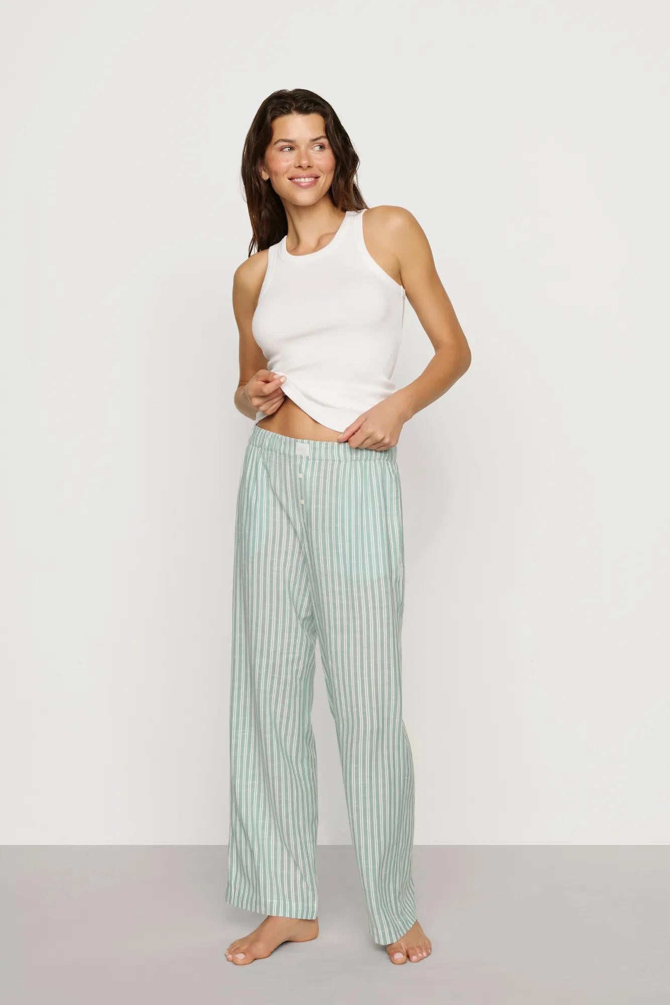 Model is wearing Nautico Boxer Pant in Regatta Stripe Seagrass/White