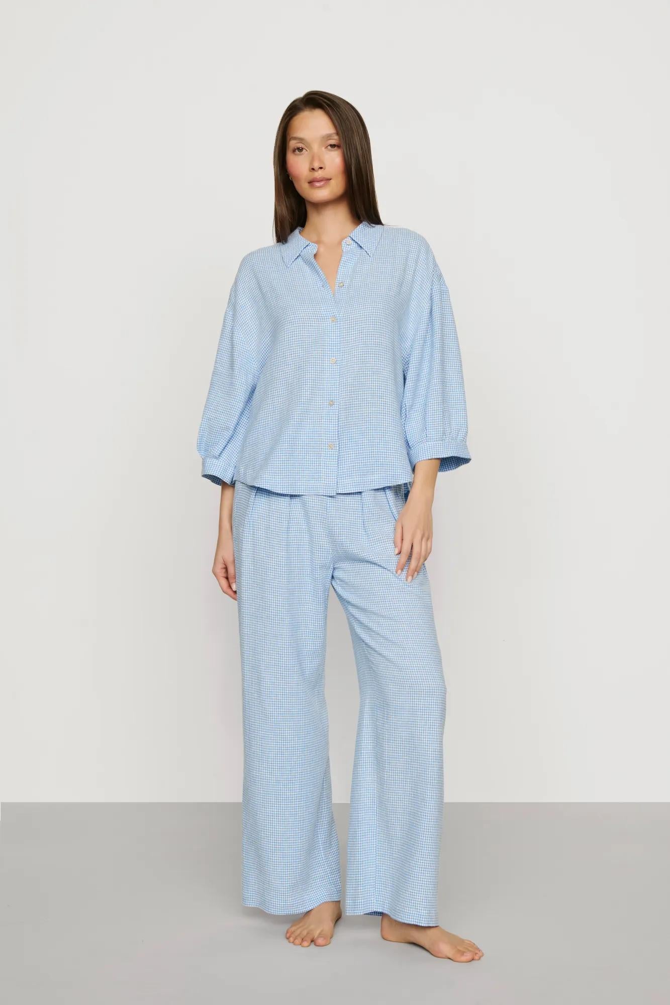 Model is wearing Linen Blend Relaxed Quarter Sleeve Top in Gingham White/Summer Blue
