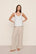 Model is wearing Linen Blend Relaxed Pant in Gingham White/Warm Taupe
